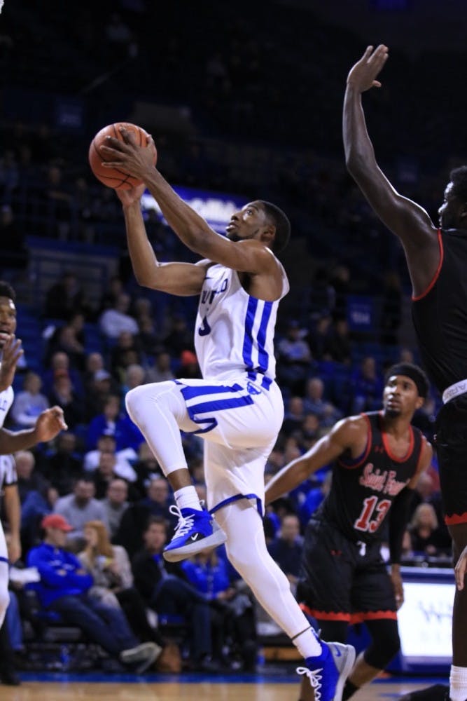 Senior guard CJ Massinburg drives for a layup. Massinburg led the Bulls with 43 points in a victory against West Virginia that vaulted them into the Top 25.