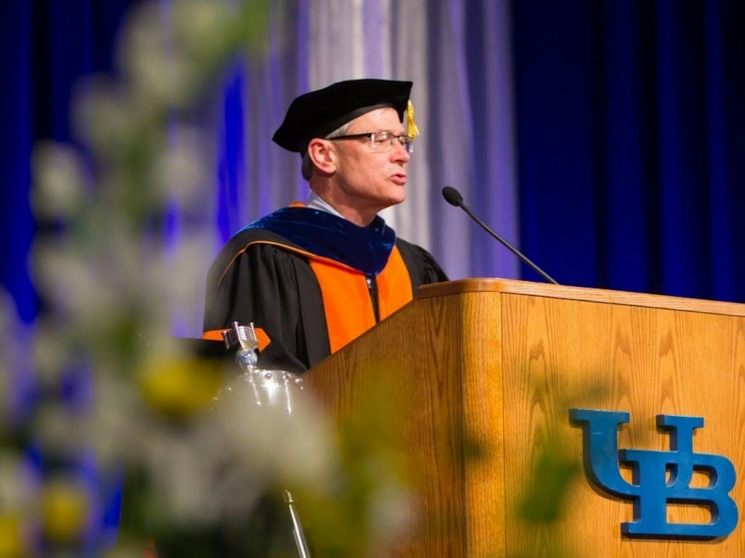 Former UB provost Charles Zukoski speaks to graduates at the university's 2018 commencement ceremony.