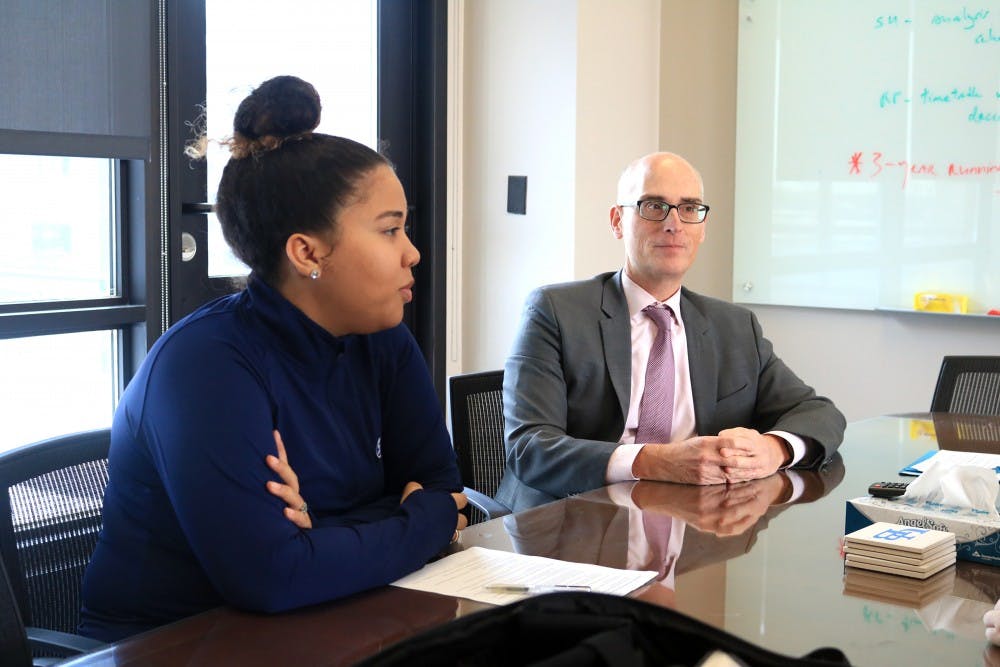 <p>&nbsp;Leslie Veloz, SA president and Graham Hammil, vice provost for educational affairs and dean of the graduate school, discuss plans for the Global Market Cafe, a new dining facility coming to North campus.&nbsp;</p><h1></h1>