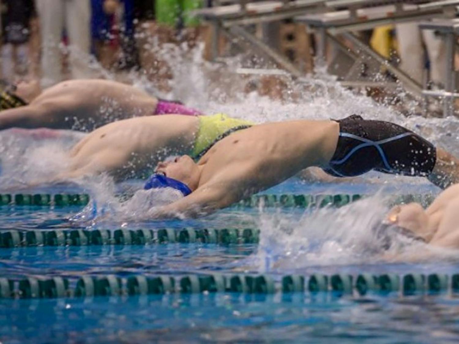 Freshman swimmer Joey Puglessi performs a backstroke. Puglessi is among six swimmers and divers being represented by attorney Richard Lydecker.