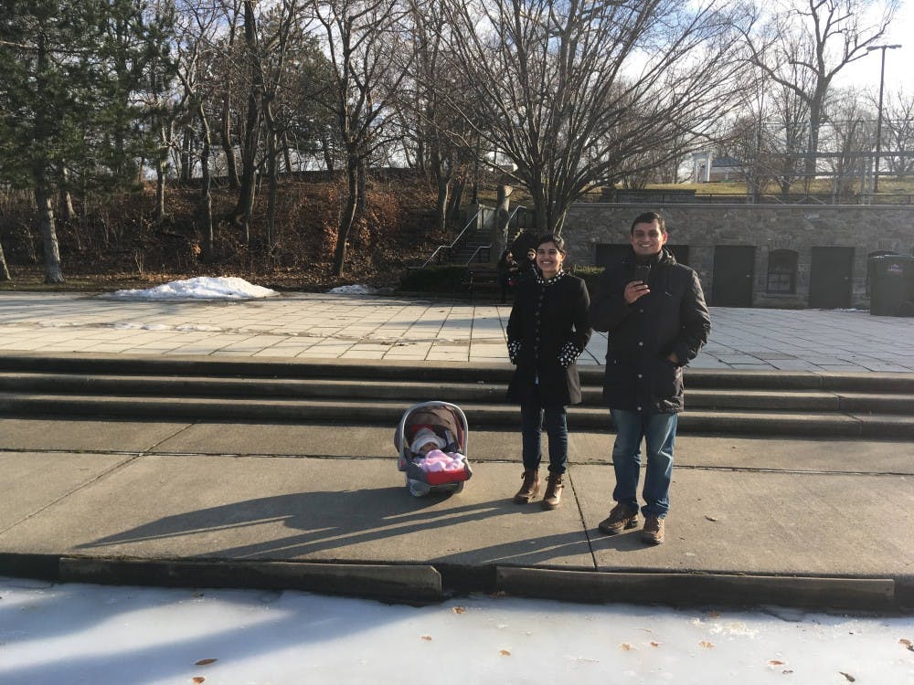 <p>Ajay Singh pictured with his wife and child. Colleagues and students remember researcher who unexpectedly died on Oct. 20.&nbsp;</p>