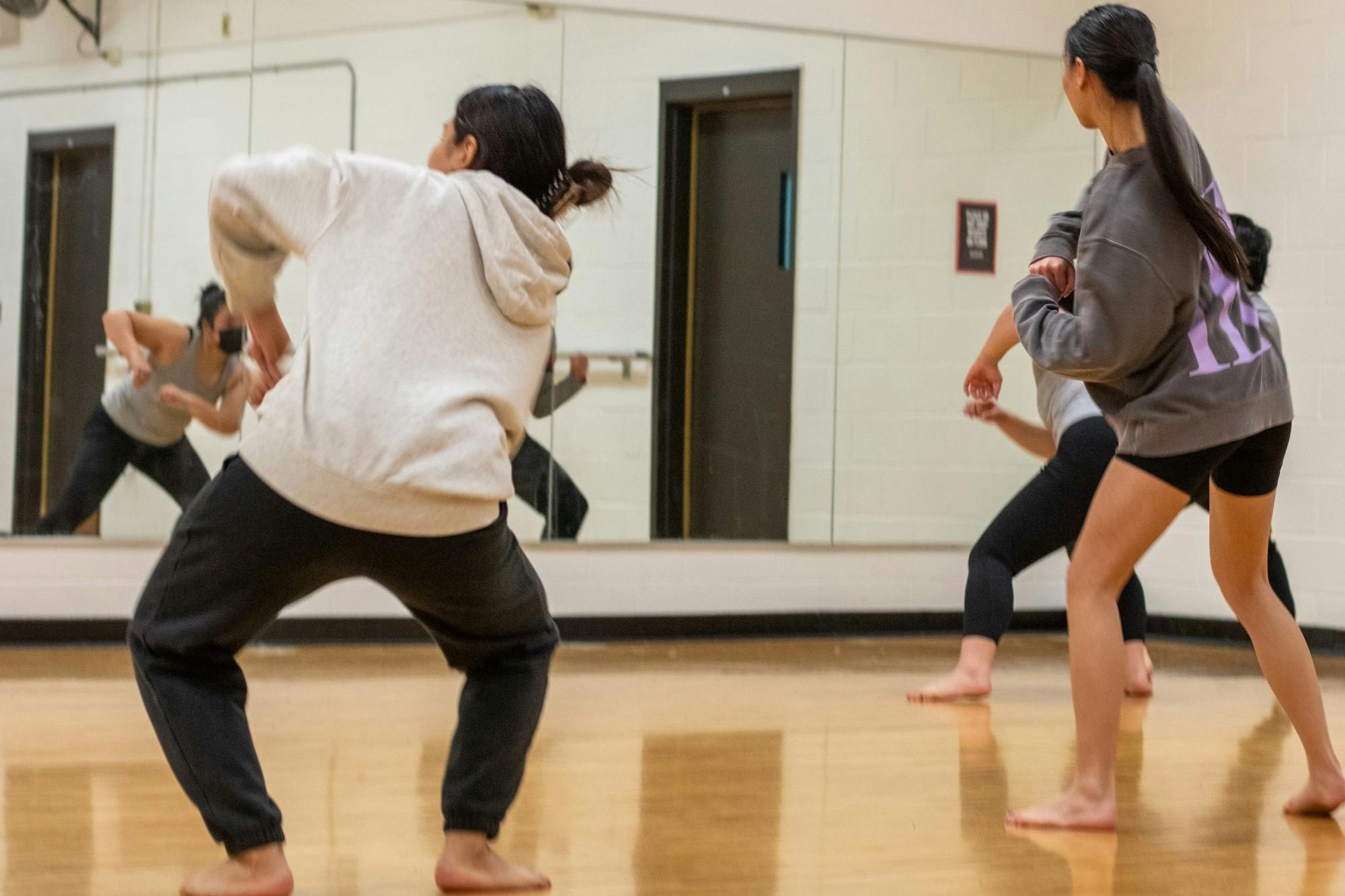 Dancers from the Asian American Student Union practice their high-energy performance in the Natural Sciences Complex.&nbsp;