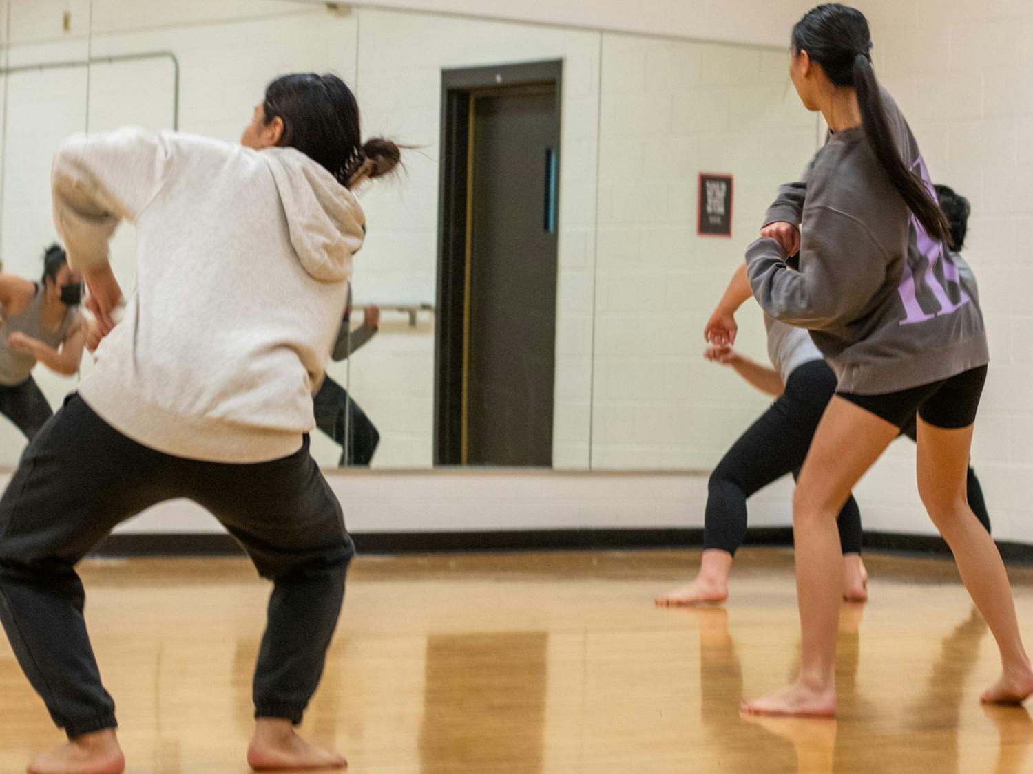 Dancers from the Asian American Student Union practice their high-energy performance in the Natural Sciences Complex.&nbsp;