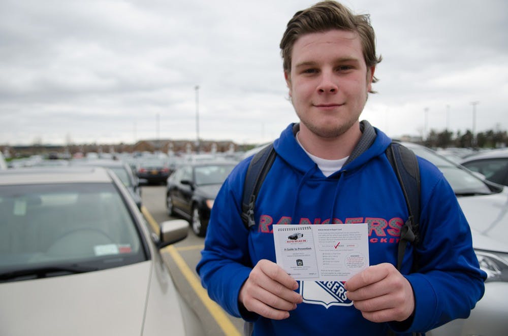 <p>Nicholas Gross, a sophomore environmental design major, a received a passing grade on the ‘Vehicle Break-in Report Card’ placed on his car. UPD checks vehicles on campus to make sure they’re not susceptible to break-ins or theft and leaves 'Vehicle Break-In Report Cards’ indicating to students whether their cars are susceptible to  break-in.</p>