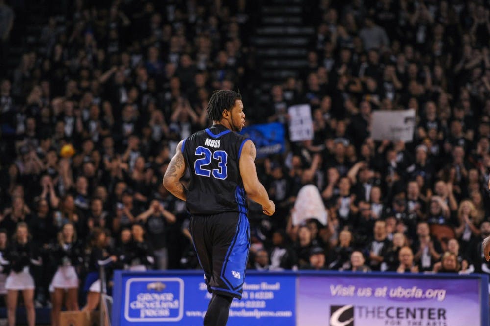 <p>Justin Moss runs down the court during UB's 80-55 victory over Kent State last season. On Monday, it was announced he has been removed from the basketball team and expelled from UB following an on-campus theft, ending his two-year stint with the Bulls.</p>