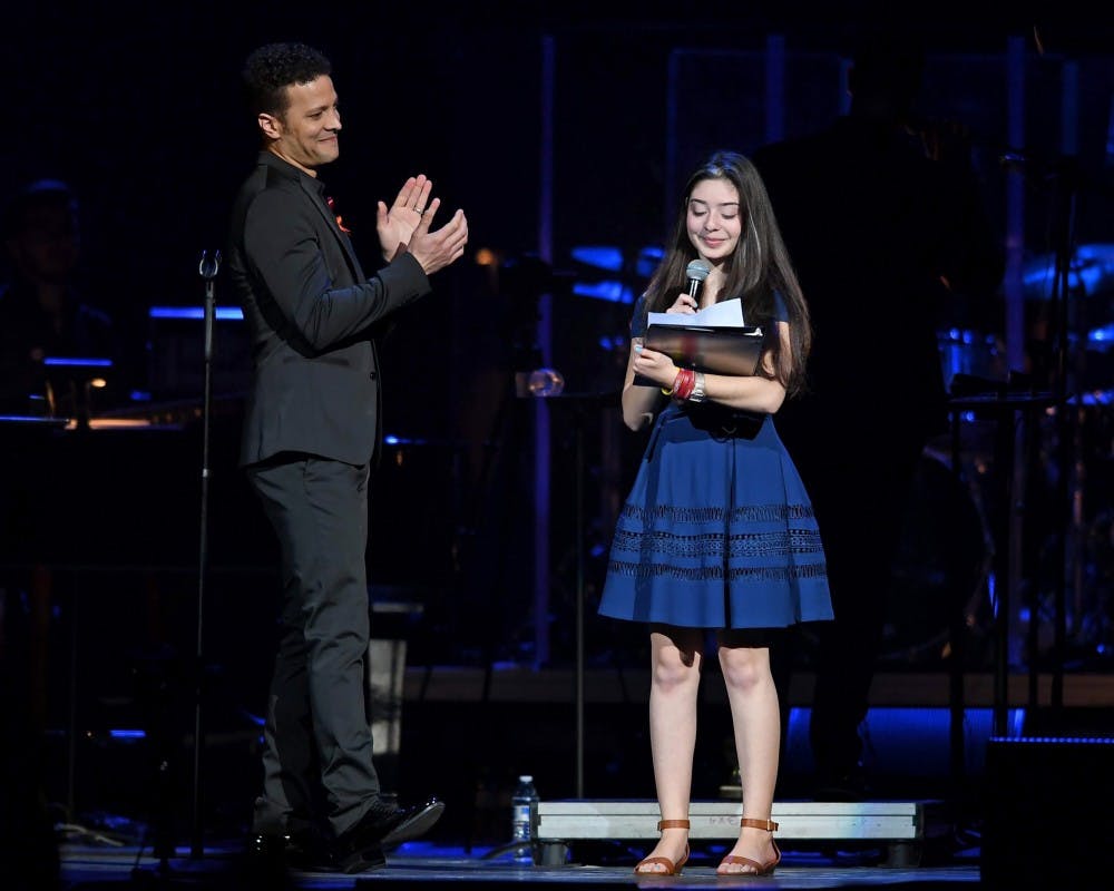 Avery Anger, a freshman at Marjory Stoneman Douglas High School, singing with singer Justin Guarini at the From Broadway With Love benefit concert.&nbsp;Avery’s father and UB Alum, Lonny Anger, is the director and vice president of media relations for Shine MSD, a nonprofit organization that benefits those affected by the Parkland shooting.