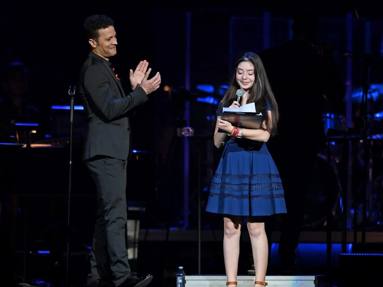 Avery Anger, a freshman at Marjory Stoneman Douglas High School, singing with singer Justin Guarini at the From Broadway With Love benefit concert. Avery’s father and UB Alum, Lonny Anger, is the director and vice president of media relations for Shine MSD, a nonprofit organization that benefits those affected by the Parkland shooting.