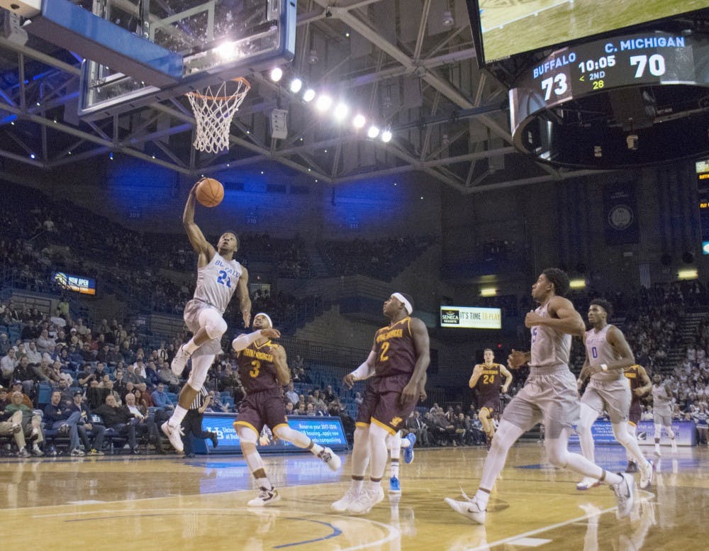 <p>Sophomore guard Dontay Caruthers dunks against Central Michigan. Caruthers was named the MAC Defensive Player of the Year.</p>
