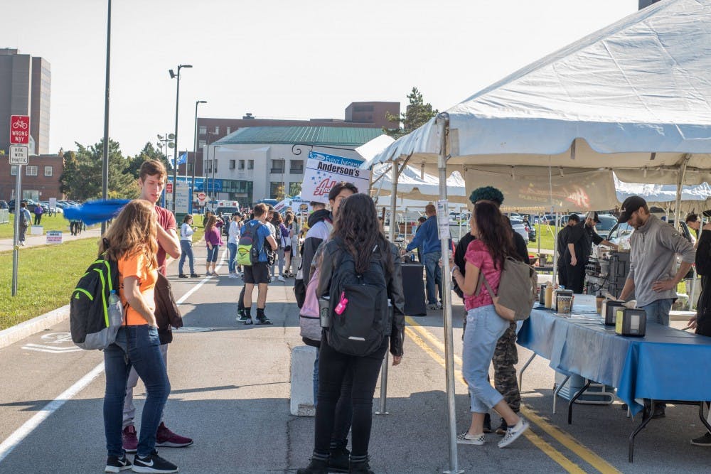 Students wait in line at the Anderson’s Frozen Custard tent Friday during SA’s first ever Fall Food Fest. Students enjoyed local food, a beer tent and a battle of the bands during the event.&nbsp;
