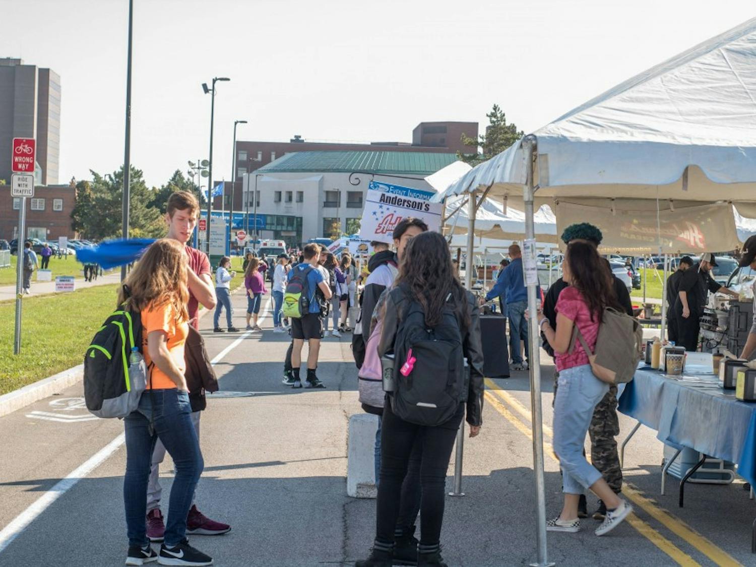 Students wait in line at the Anderson’s Frozen Custard tent Friday during SA’s first ever Fall Food Fest. Students enjoyed local food, a beer tent and a battle of the bands during the event.&nbsp;