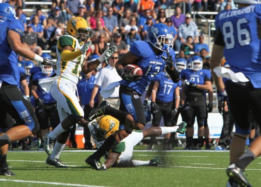 Senior wide receiver Devon Hughes scores a 92-yard touchdown in the first quarter of Buffalo&#39;s 36-7 victory over Norfolk State Saturday. The play set a new program-record for longest receiving touchdown.
Chad Cooper, The Spectrum