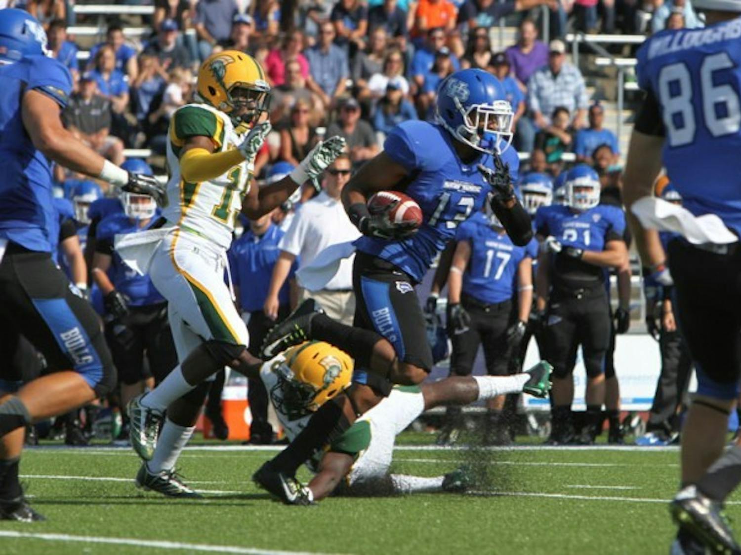 Senior wide receiver Devon Hughes scores a 92-yard touchdown in the first quarter of Buffalo&#39;s 36-7 victory over Norfolk State Saturday. The play set a new program-record for longest receiving touchdown.
Chad Cooper, The Spectrum