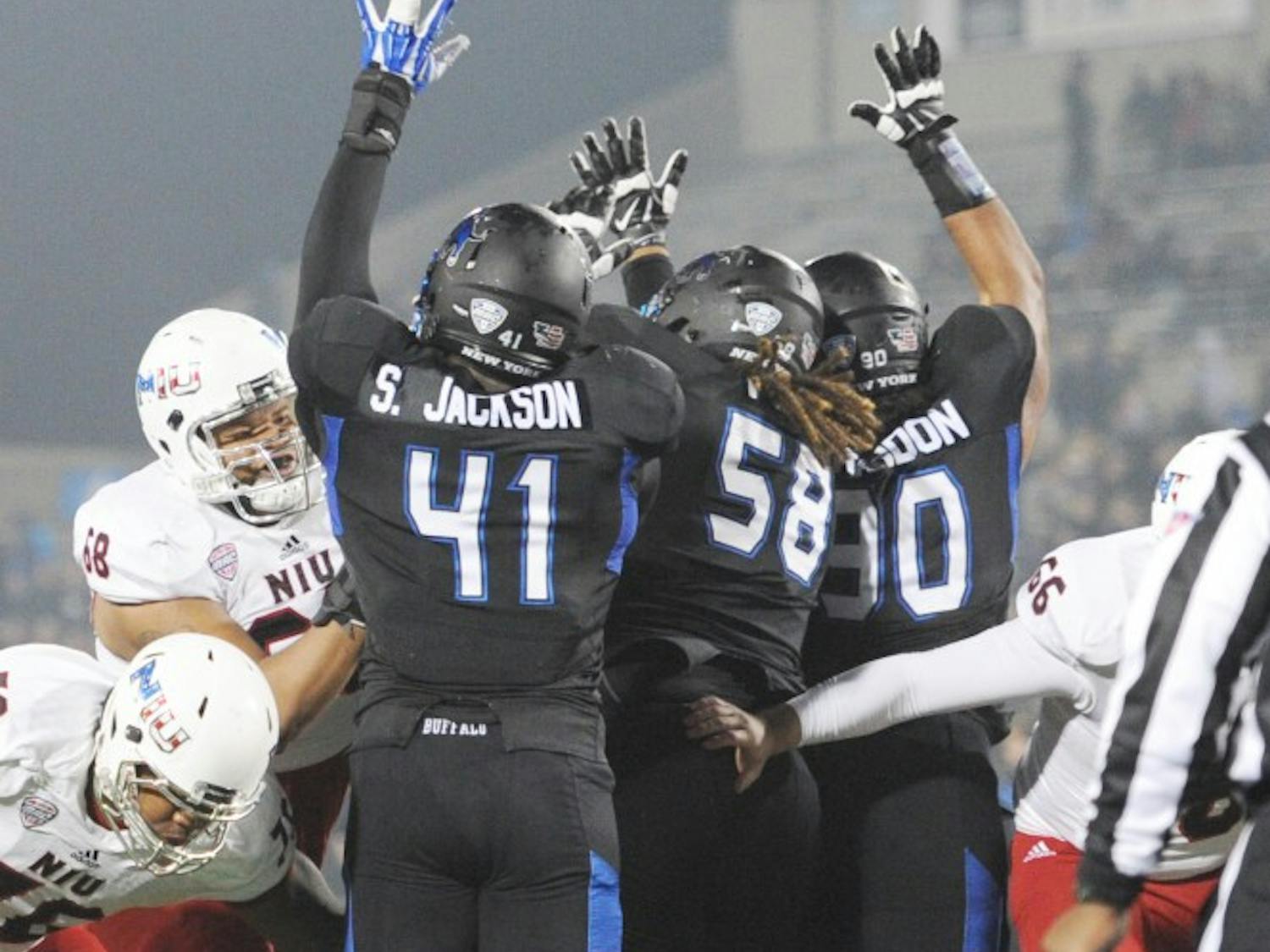 Solomon Jackson and his teammates work to block a kick during a Bulls' game against Northern Illinois in November 2015. 