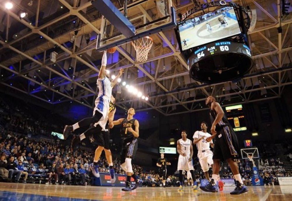 Justin Moss slams a dunk in Buffalo&#39;s 69-67 season opening victory over South Dakota State Friday night. Moss had a career-high 25 points and 13 rebounds.&nbsp;Yusong Shi, The Spectrum.