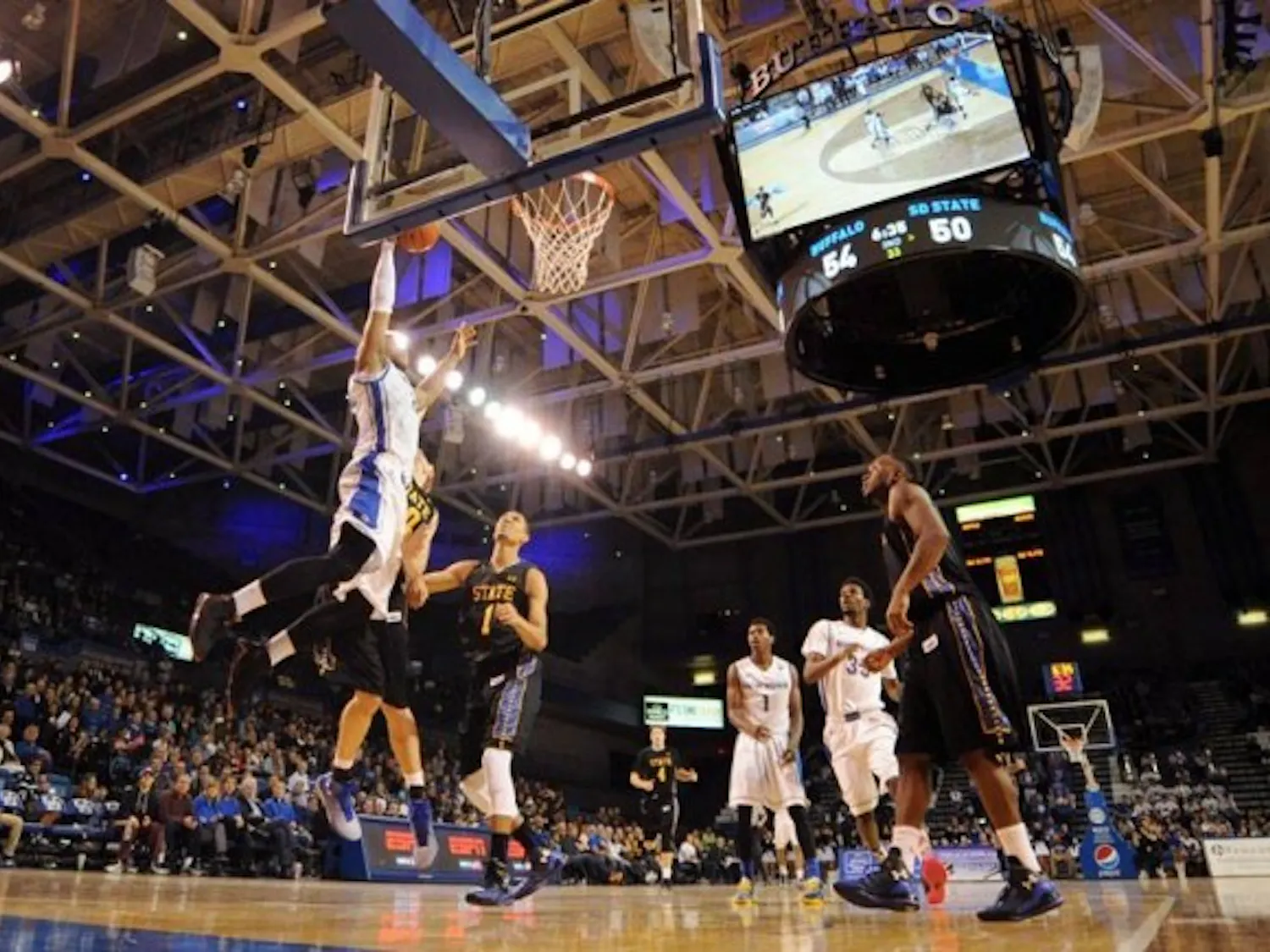 Justin Moss slams a dunk in Buffalo's 69-67 season opening victory over South Dakota State Friday night. Moss had a career-high 25 points and 13 rebounds. Yusong Shi, The Spectrum.