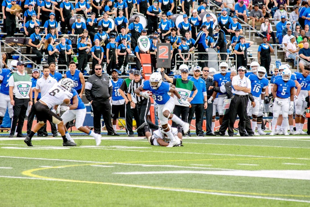 <p>Redshirt junior receiver Anthony Johnson breaks a tackle in Saturday’s game. Johnson had double digit catches for the first time in his career and finished with 11 interceptions for 195 yards and two scores. </p>