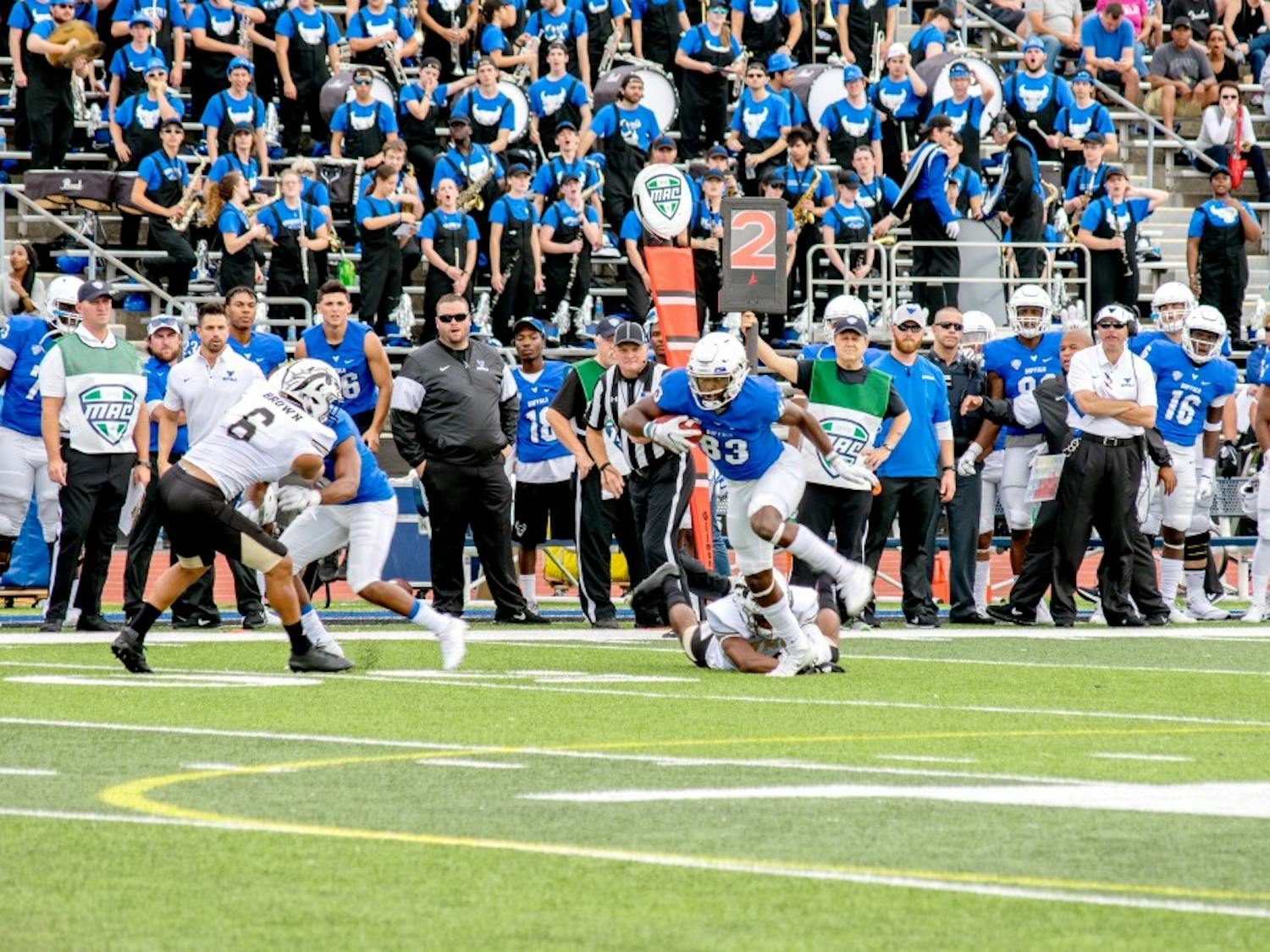 Redshirt junior receiver Anthony Johnson breaks a tackle in Saturday’s game. Johnson had double digit catches for the first time in his career and finished with 11 interceptions for 195 yards and two scores.