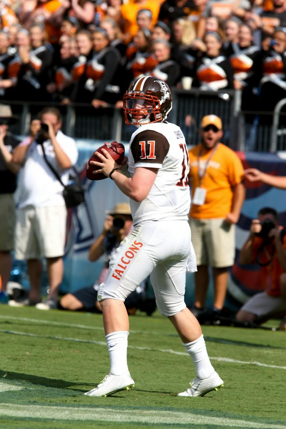<p>Senior quarterback Matt Johnson looks to complete the pass. Johnson leads the nation in passing yards with 1760.</p>