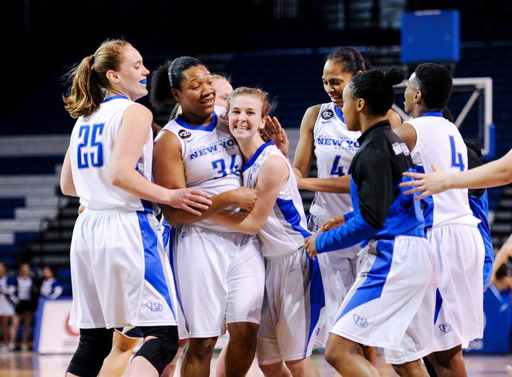 <p>(From left to right) Senior forward Kristen Sharkey, sophomore forward Alexus Malone, freshman guard Stephanie Reid, Senior forward Christa Baccas and sophomore guards Karin Moss and Joanna Smith embrace one another in Buffalo's 87-80 victory over Akron on Feb. 28. The Bulls are a No. 4 seed in the MAC Tournament. </p>