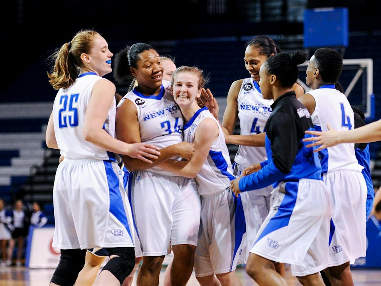 (From left to right) Senior forward Kristen Sharkey, sophomore forward Alexus Malone, freshman guard Stephanie Reid, Senior forward Christa Baccas and sophomore guards Karin Moss and Joanna Smith embrace one another in Buffalo's 87-80 victory over Akron on Feb. 28. The Bulls are a No. 4 seed in the MAC Tournament.