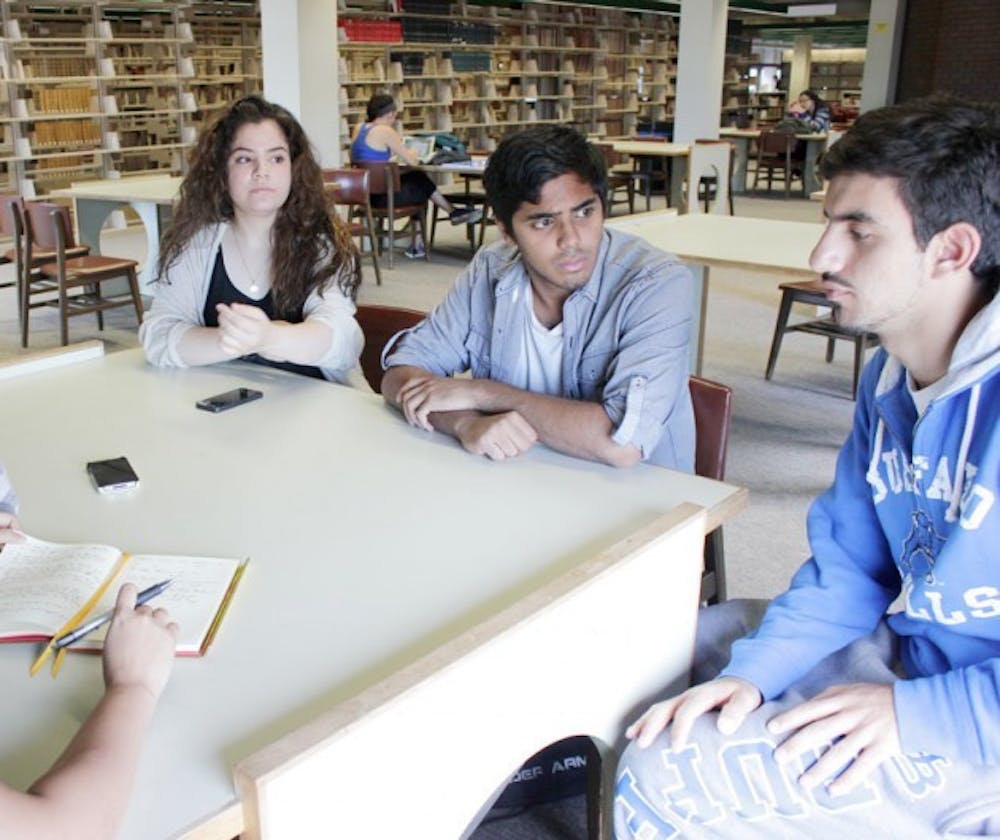 Manar Kustiro (left) is president of UB&#39;s chapter of Students for Justice in Palestine and co-founded the club in the fall of 2013. Along with Talha Rahman (center) and Fadi Suboh (right), Kustiro discusses plans the group has for this semester.
Courtesty of Safra Bacchus&nbsp;