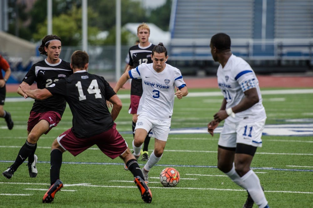<p>Junior defender Daniel Cramarossa attempts to split two defenders. The Bulls tied with Niagara 2-2 on Sunday, pushing their winless streak to six games.</p>
