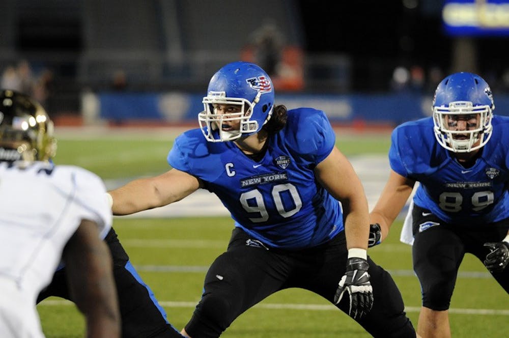 <p>Kristjan Sokoli (90) setting up on the defensive line before the snap. Sokoli was drafted in the sixth round of the 2015 NFL draft by the Seattle Seahawks and is transitioning to playing center.</p>