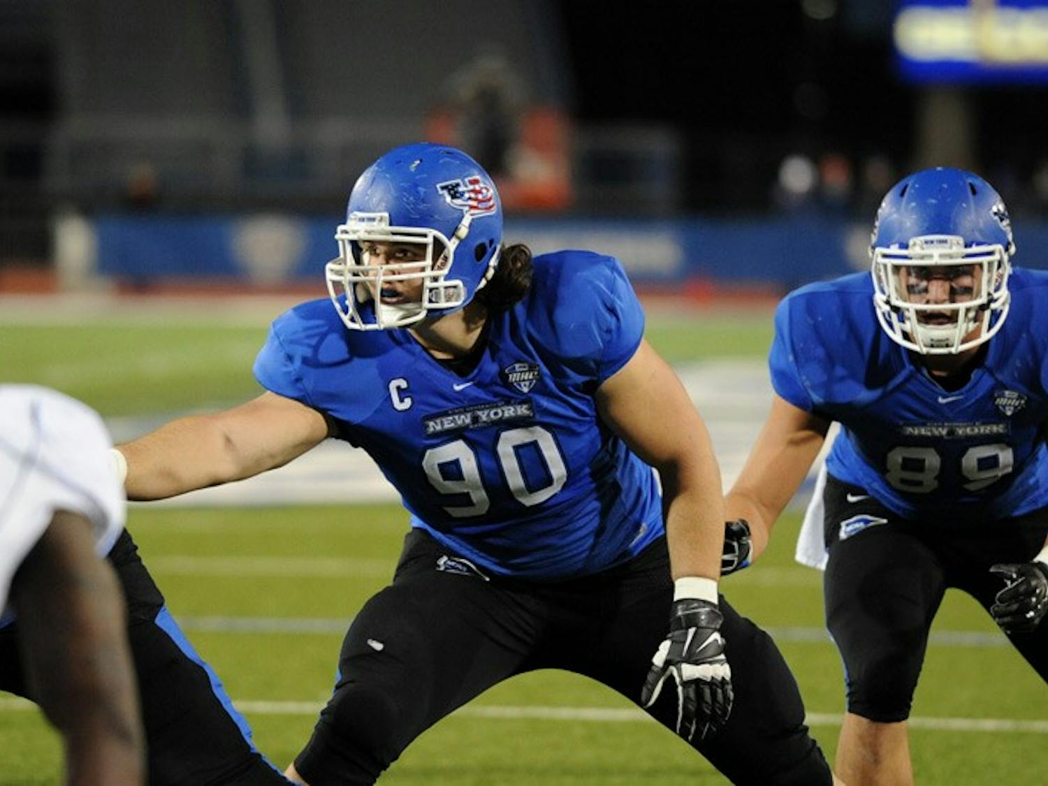 Kristjan Sokoli (90) setting up on the defensive line before the snap. Sokoli was drafted in the sixth round of the 2015 NFL draft by the Seattle Seahawks and is transitioning to playing center.