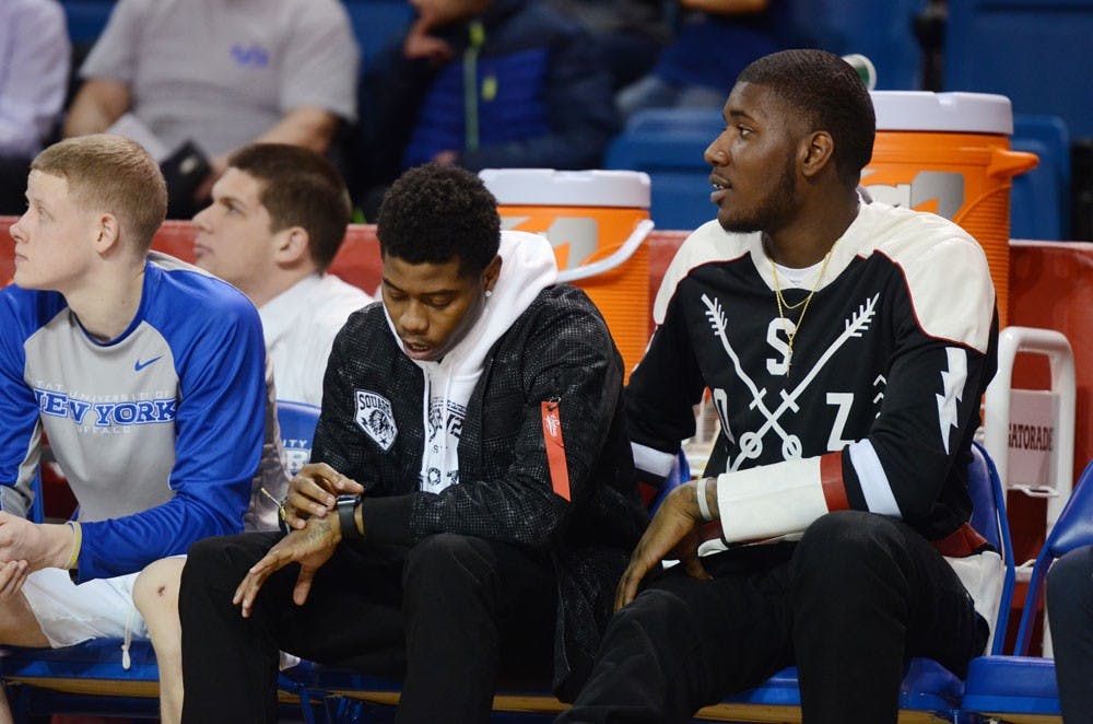 <p>Sophomore guard Lamonte Bearden checks his watch on the bench during Buffalo's 71-69 loss to Toledo Tuesday night. Bearden was suspended indefinitely for "conduct detrimental to the team."</p>