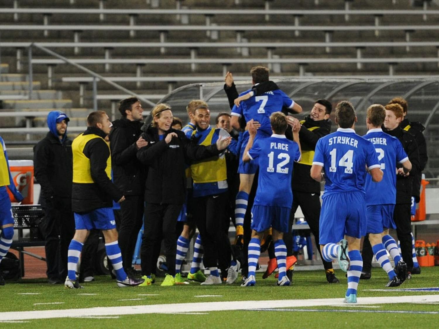 The men’s team celebrates a victory on the field. For Spring break, the Bulls will travel to the United Kingdom to gain experience while submersed in the English soccer culture.