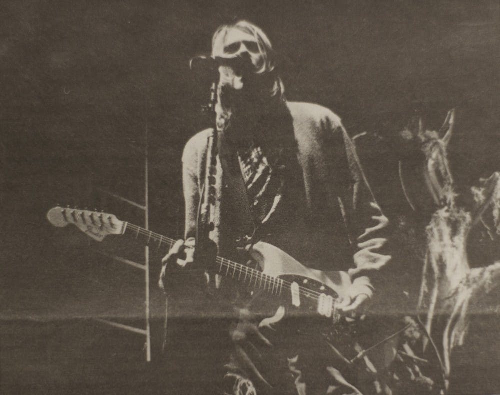 <p>Kurt Cobain shreds in front of 7,000 fans at Alumni Arena in 1993. Cobain and his band Nirvana played a sold-out show at UB 25 years ago today, and students brought them here.</p>