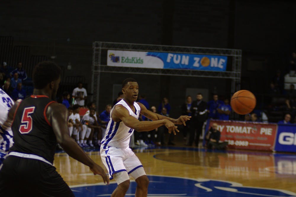 <p>Junior guard Davonta Jordan dishes the ball to his teammate. The Bulls beat Dartmouth 110-71 Wednesday night, with Jordan finishing with 16 points and 4 assist.</p>
