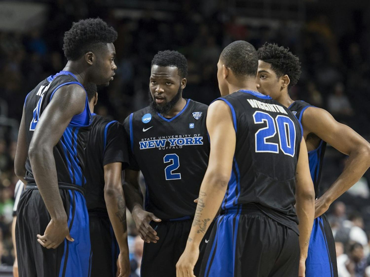 Junior wing Willie Conner (2) leads a Bulls team huddle during their NCAA Tournament matchup against No. 3 seed Miami.&nbsp;