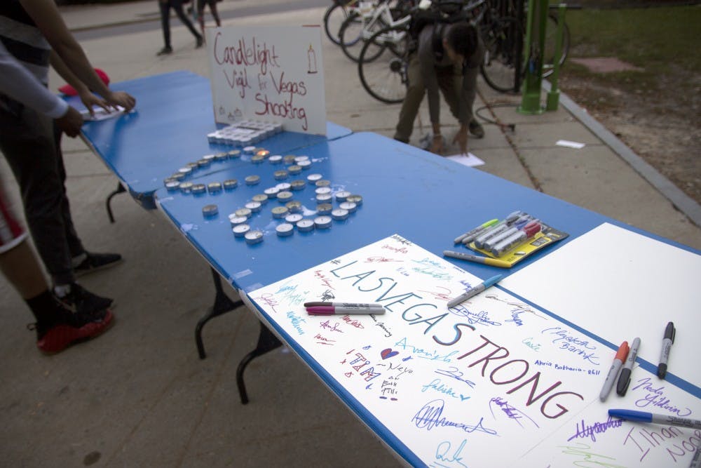 <p>Tuesday evening a candle light vigil was held outside the Student Union.  Students showed their support for victims of the Route 91 Harvest Festival shooting. </p>