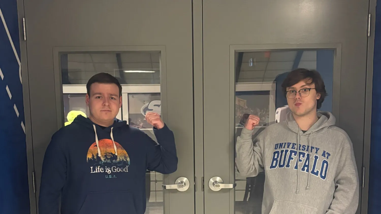 A photo of SA Senators Grant Peterson (right) and Joshua Brodsky (left) in front of the undergraduate Student Association's office doors