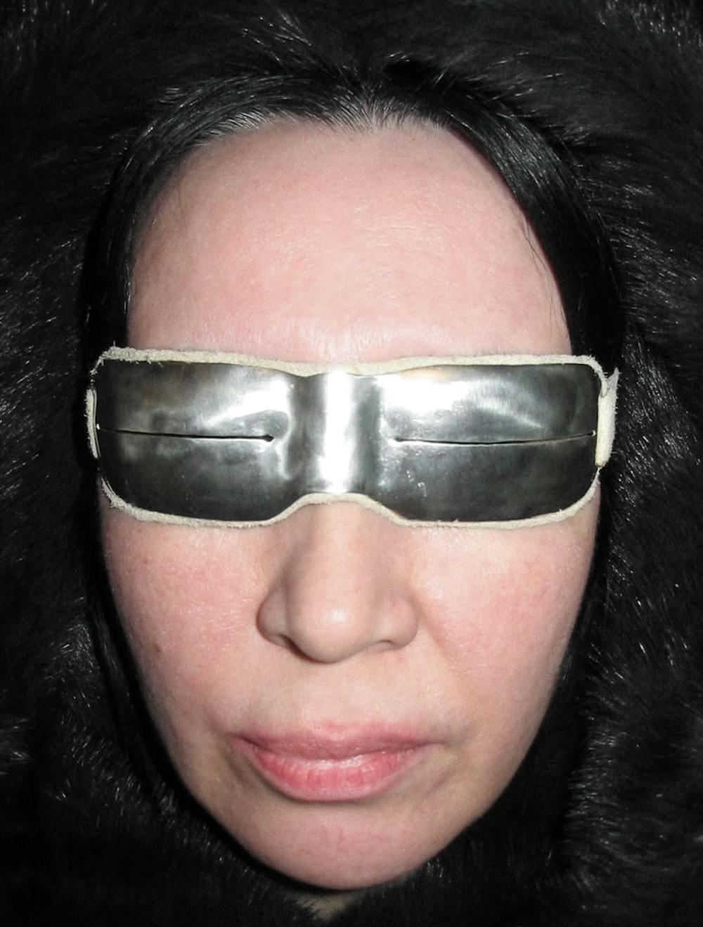 Edʼiiý [sakha] - auntie, wearing silver 925 rectangle Arctic snow goggles in ivory suede leather @ursuuna.archive on instagram
