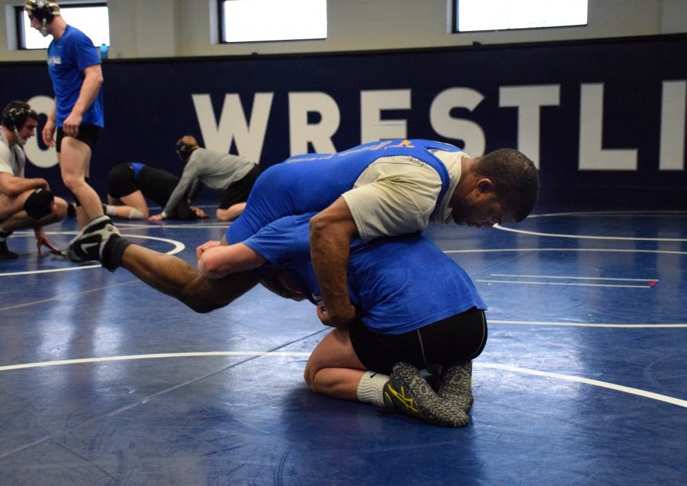 <p>Two UB Wrestlers grapple at a practice. The Bulls will head to Northern Iowa this weekend to compete in MAC Championships.</p>