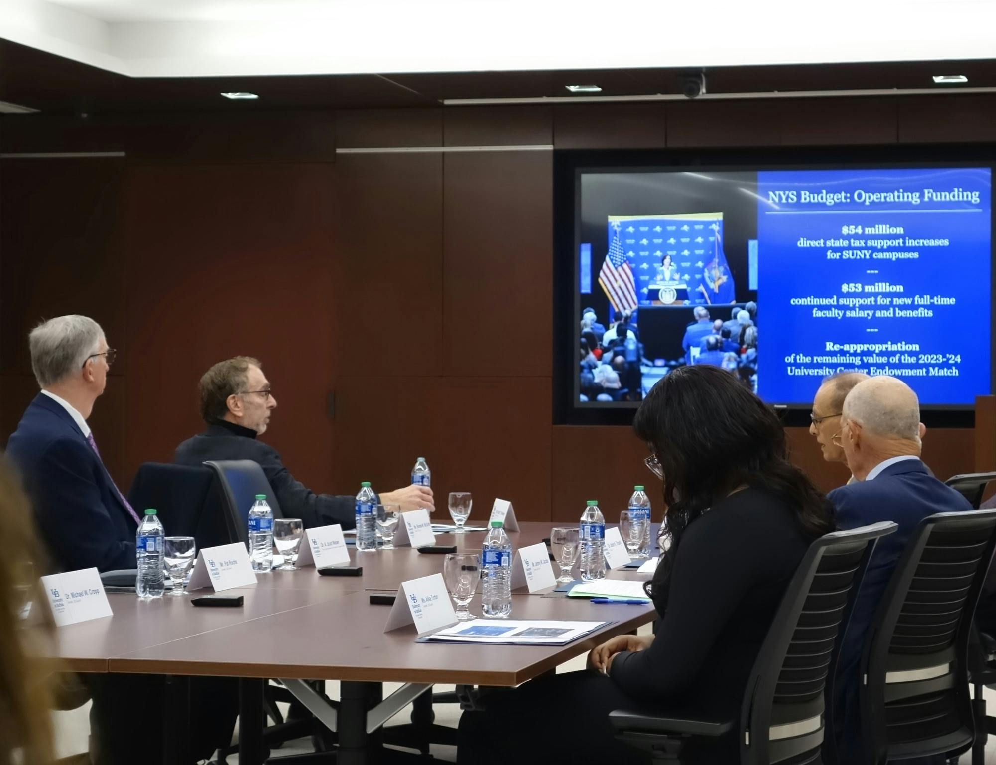 Alika Turton (front, at right) listens while UB President Satish Tripathi speaks at a UB Council meeting on Monday, March 11, 2024. Voters re-elected Turton to a second term as UB Council Student Representative.
