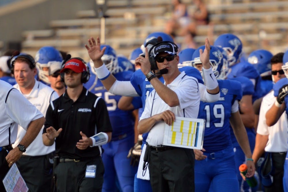 <p>Head coach Lance Leipold celebrates a Buffalo touchdown during the Bulls' 51-14 victory against Albany Saturday. </p>