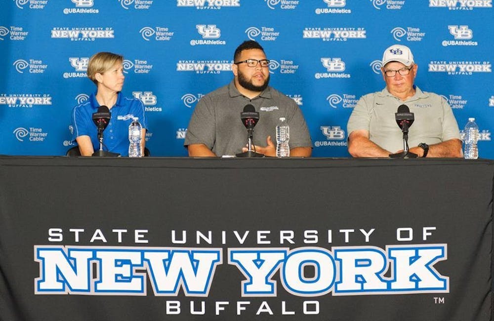 <p>(From left to right) Buffalo head coach Vicki Mitchell, senior thrower Jonathan Jones and assistant and throws coach Jim Garnham address the media in Alumni Arena Monday morning. Jones will compete to qualify in the world championships. </p>