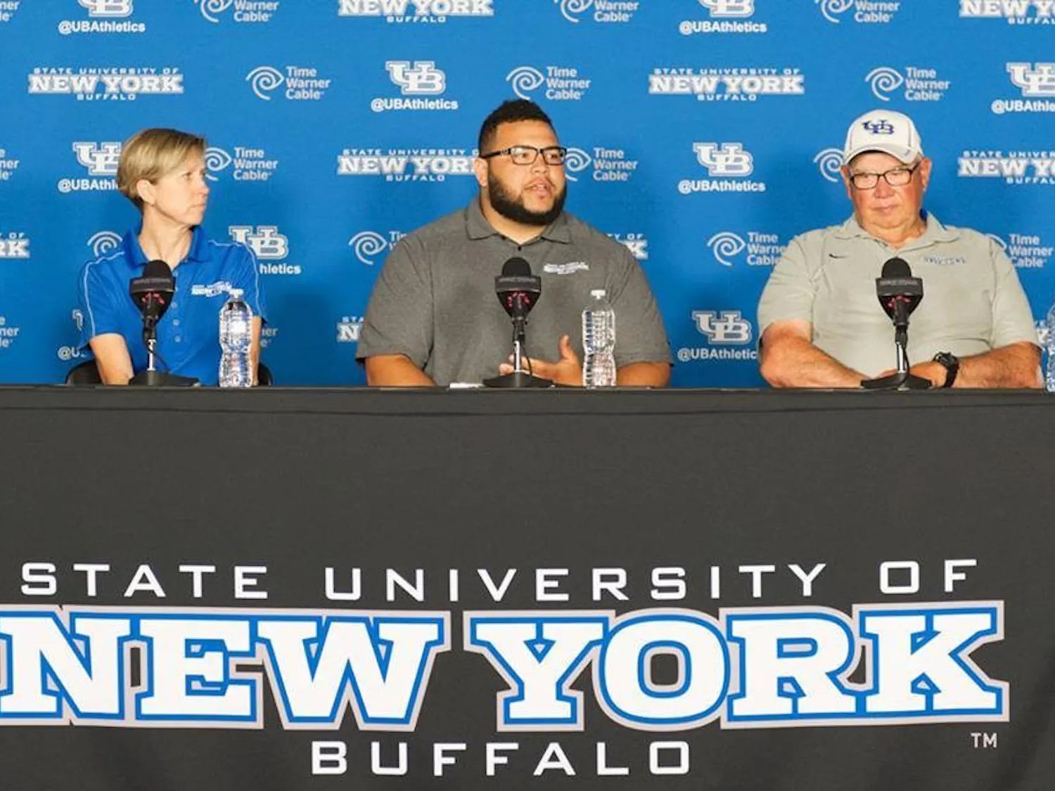 (From left to right) Buffalo head coach Vicki Mitchell, senior thrower Jonathan Jones and assistant and throws coach Jim Garnham address the media in Alumni Arena Monday morning. Jones will compete to qualify in the world championships.