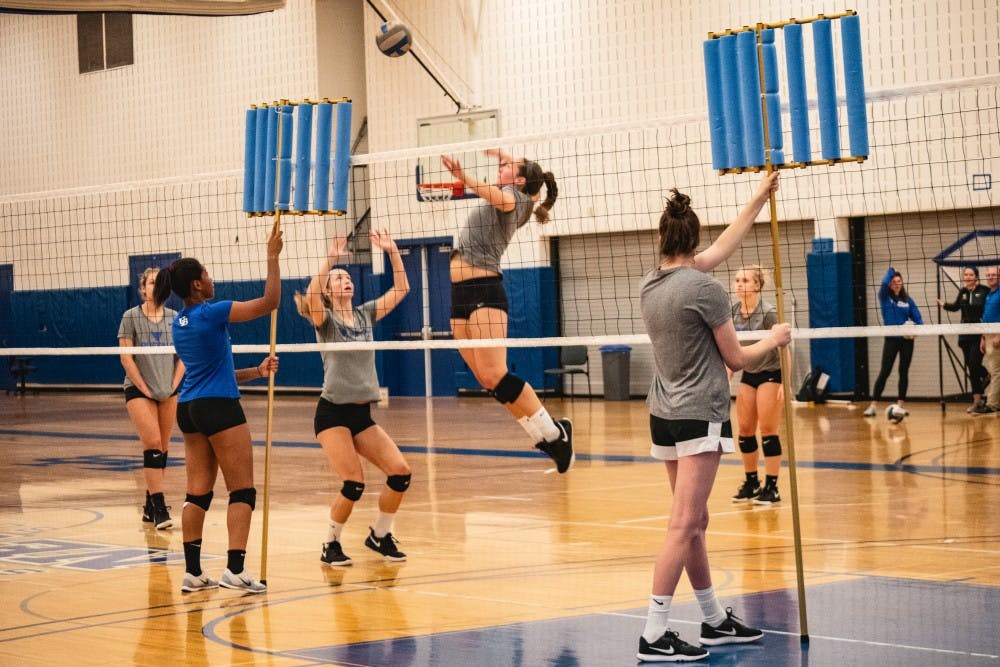 <p>A Bull gets ready to spike the ball at volleyball practice.</p>