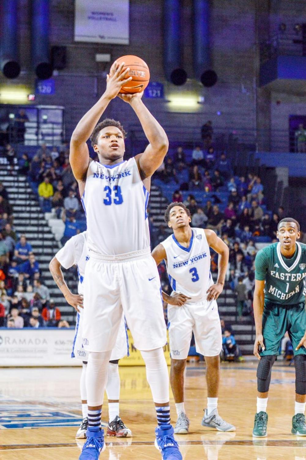 <p>Freshman forward Nick Perkins attempts a free throw during Buffalo's 80-70 victory over Eastern Michigan on Feb. 6. Perkins has been a versatile big man for the Bulls this season.&nbsp;</p>