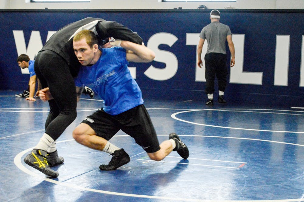 <p>Buffalo&nbsp;freshman Kyle Akins looks to take redshirt freshman Bryan Lantry off his feet for the takedown during sparring practice on Tuesday. The 125-pounder is currently ranked 33rd in the country.</p>