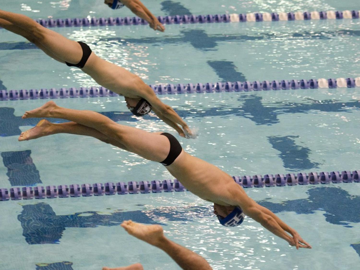 UB men's swimming and diving team practices. Donors and alumni of the team are attempting to save the team from being cut. 