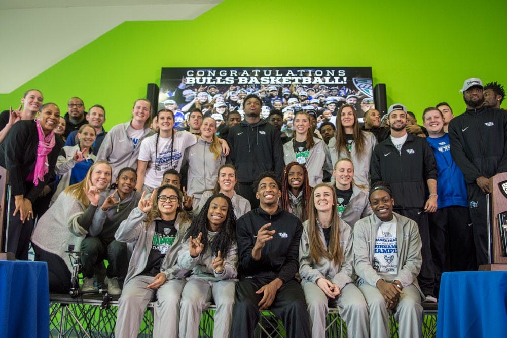<p>Both the men’s and women’s basketball teams come together for a group photo during Tuesday’s rally in the Student Union. Both teams won their respective Mid-American Championships last week and made NCAA Tournament appearances.</p>