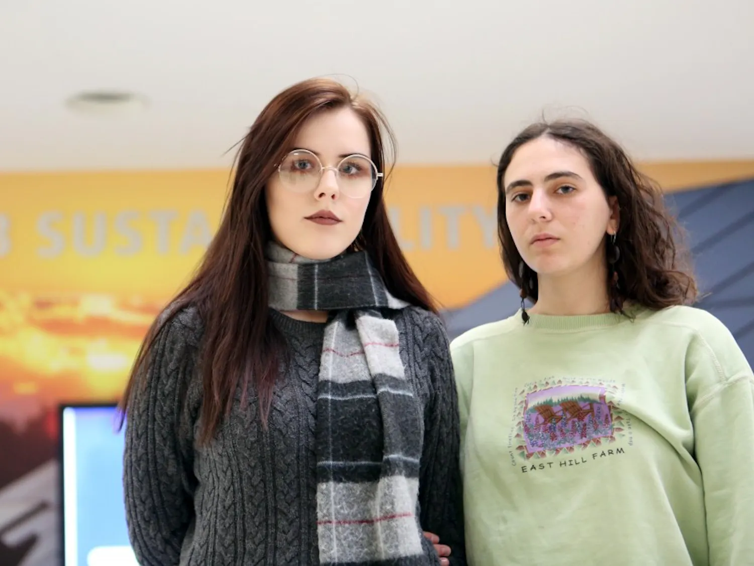 Sophomore environmental design major Sophia Rogllio (left) and freshman environmental studies and art major Alexa Ringer (right) were disappointed and frustrated to learn that the UB Foundation invests in fracking, which leaked documents revealed on Nov. 17. Rogillio and Ringer are members of UB Fossil Free, an organization that advocates for the university to divest from fossil fuel industries.