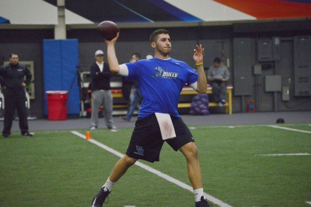 <p>Joe Licata attempts a pass at UB's Pro Day this past month. Licata and 11 former teammates attempted to impress professional scouts and ranks No. 10 on our monthly top-10 list.&nbsp;</p>