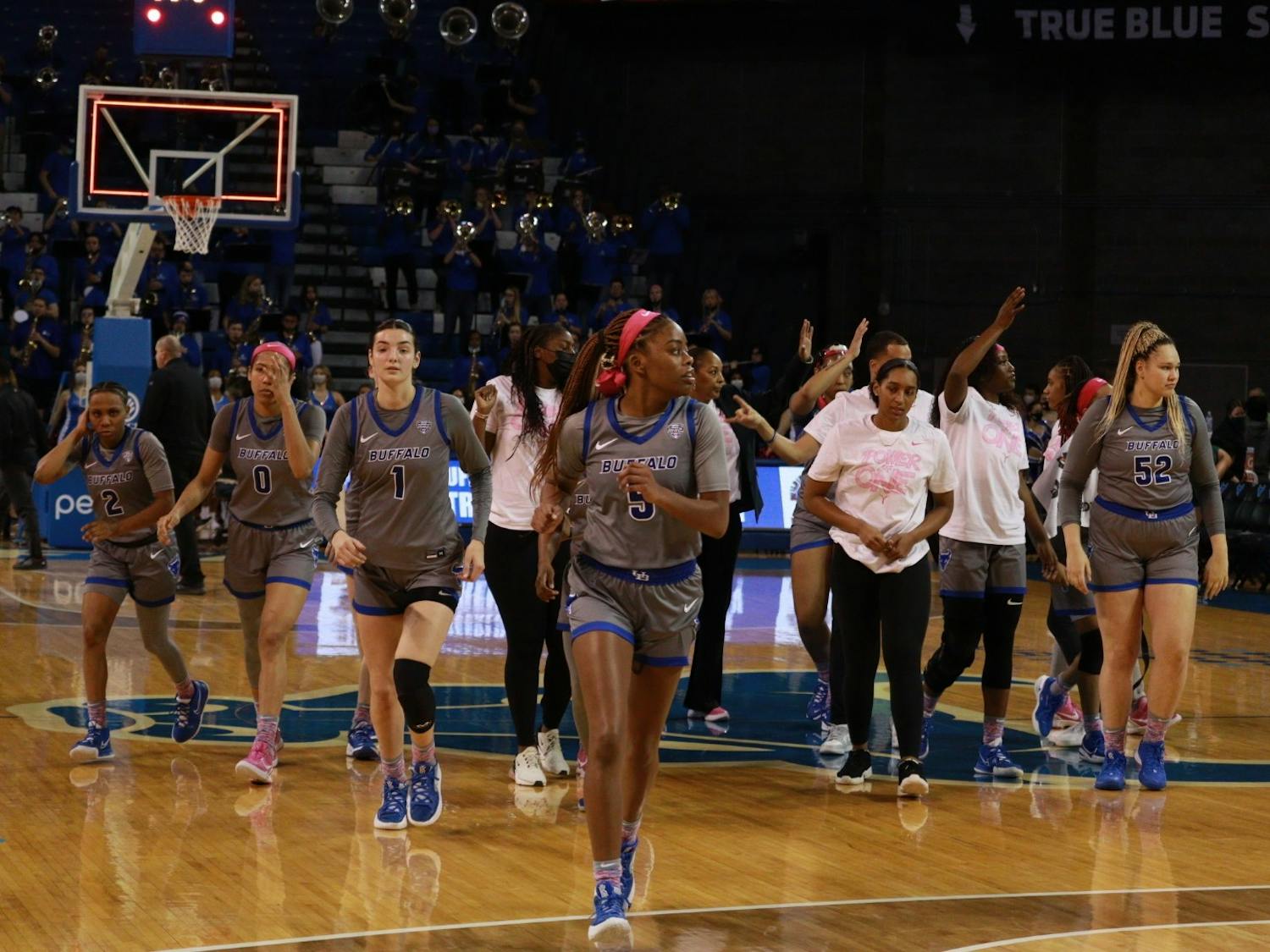 Junior guard Nia Jordan (5) and the rest of the UB women's basketball team runs off the court following a recent game.