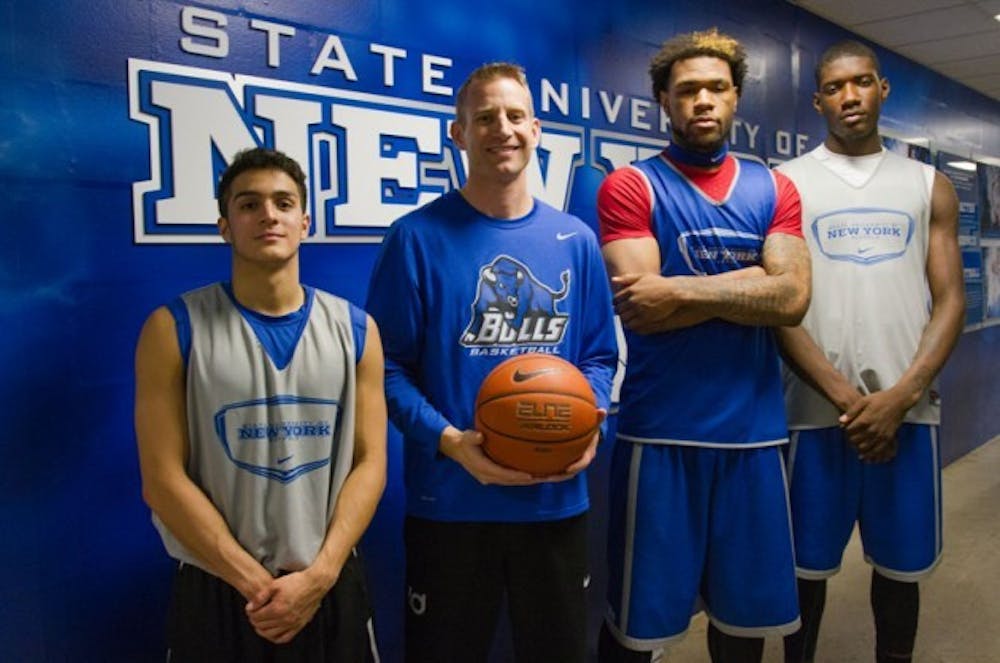 <p>Nate Oats (second from left) will be the new head coach of the men's basketball team after former head coach Bobby Hurley accepted the head coach vacancy at Arizona State. Oats coached three current Bulls players at Romulus High School in Detroit, Michigan, including (L-R) freshman guard Christian Pino, MAC Player of the Year Justin Moss and junior forward Raheem Johnson.</p>